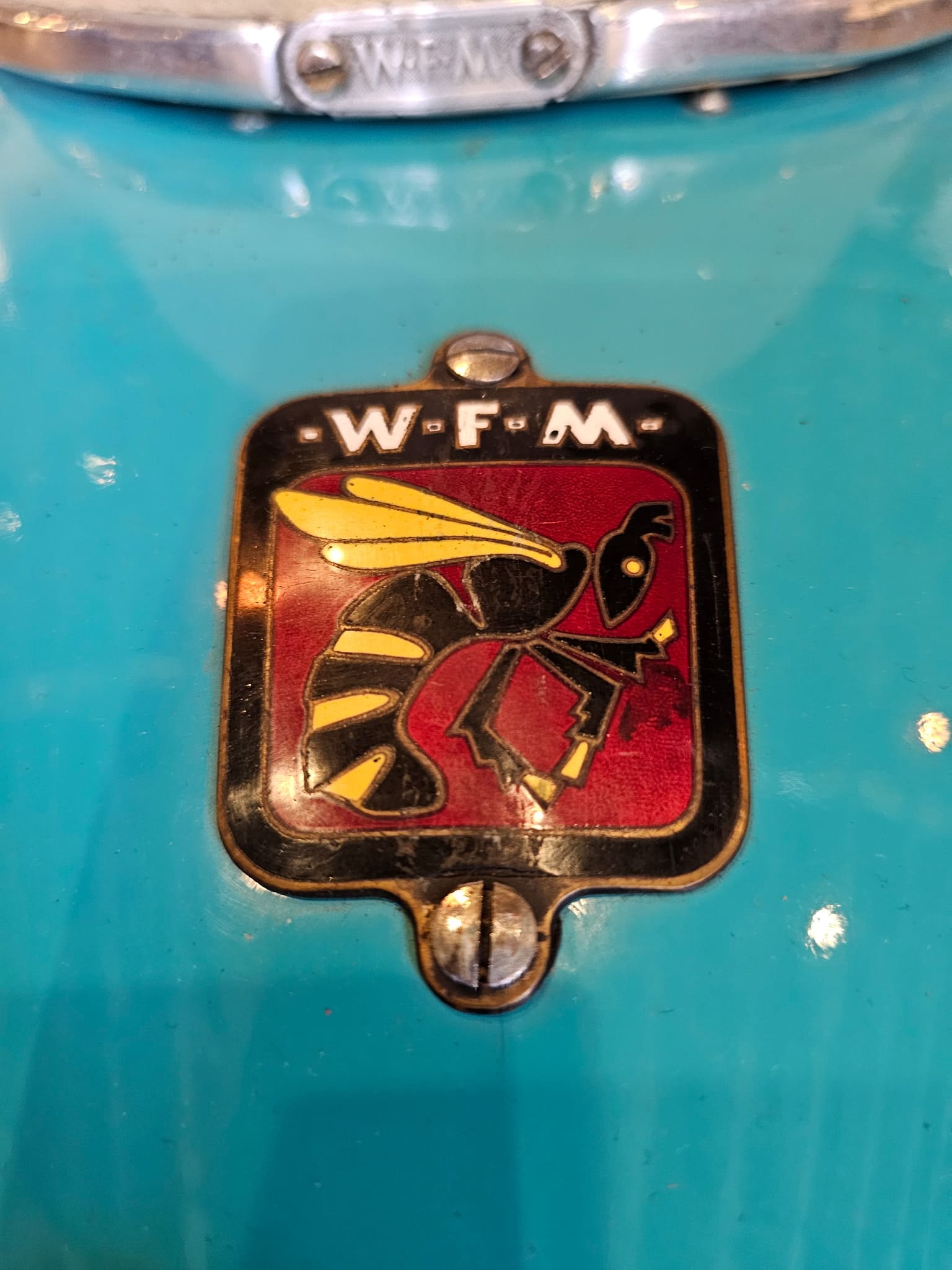 Enameled WFM hornet badge